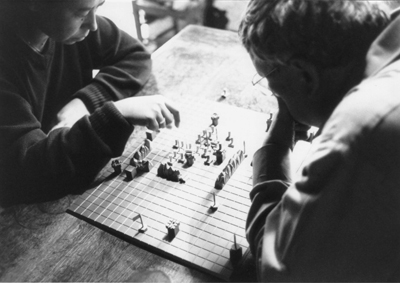 Alice Becker-Ho and Guy Debord playing the Game of War, 1977.