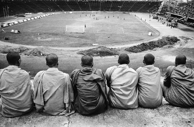 Cambodian monks watch a soccer match, 1999.