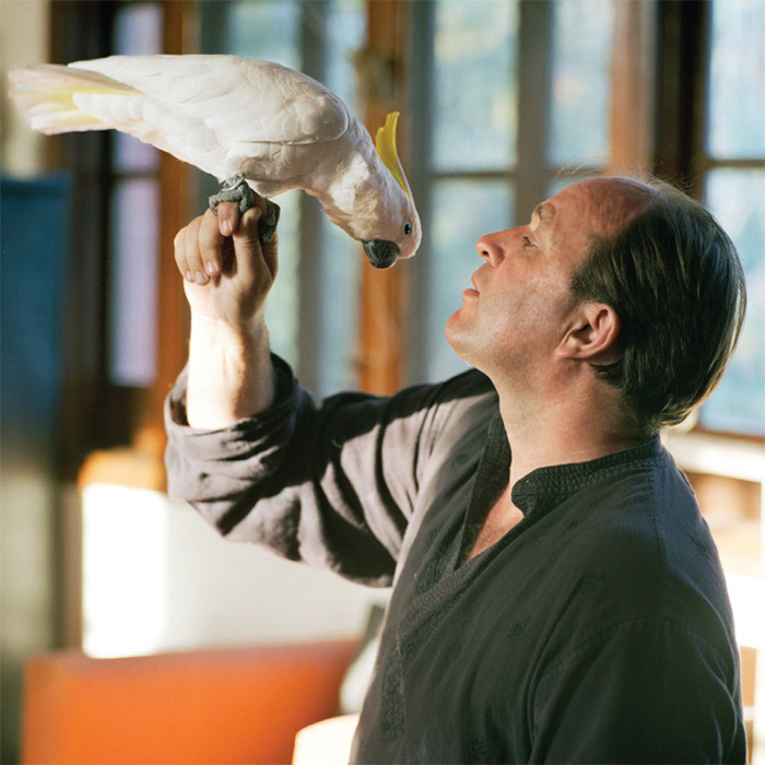 William Dalrymple with Albinia, his pet cockatoo, at home in New Delhi.