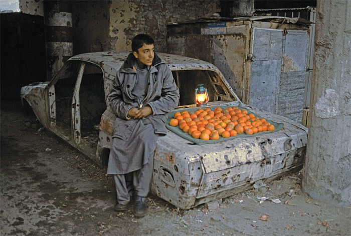 Boy selling oranges on the street, Kabul, 2003.