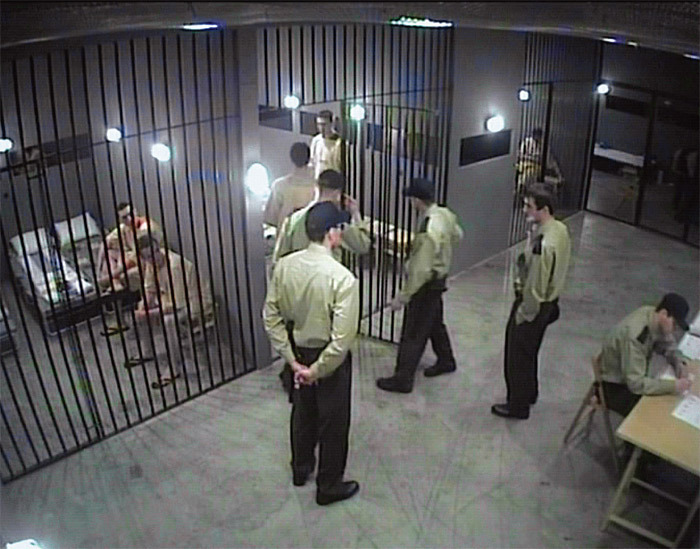 Still from artist Artur Żmijewski’s documentary work Powtórzenie (Repetition), 2005, a reenactment of the 1971 Stanford prison experiment.