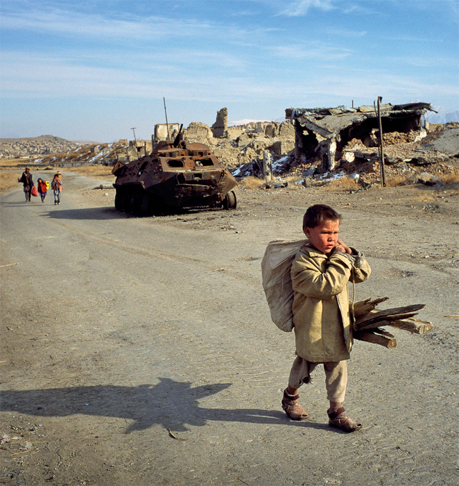 Boy collecting wood in the old, destroyed city of Kabul, 1994.