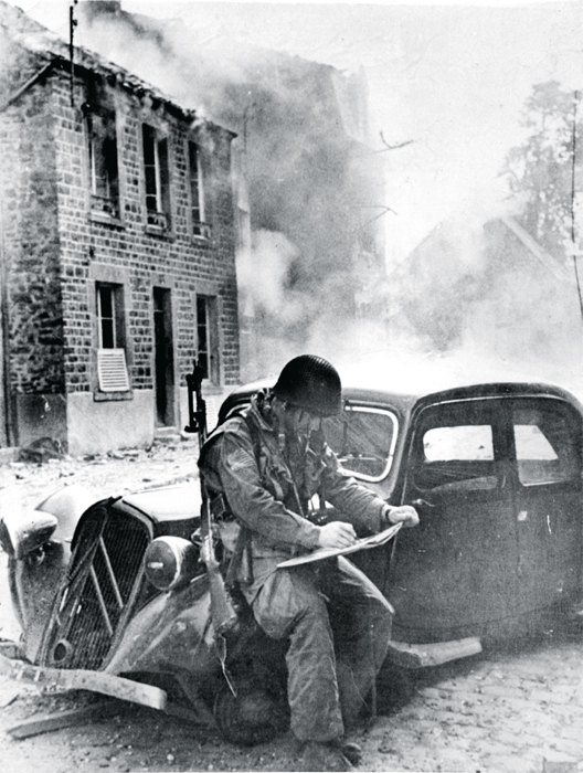 Robert Capa, Doesn’t Mind the Heat, Somewhere in France (Saint-Sauveur-Le-Vicomte), June 16, 1944, gelatin silver print. From “Capa: Europe 1943–1945,” Galerie Daniel Blau, London, 2014.