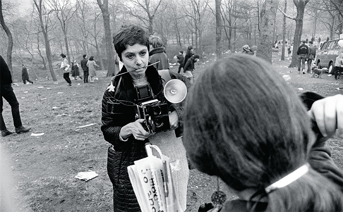 Garry Winogrand, Diane Arbus, Love-In, Central Park, New York City, 1969, gelatin silver print, 12 3/8 × 18 1/2". From the series “Big Shots,” 1969. © The Estate of Garry Winogrand, Courtesy Fraenkel Gallery, San Francisco.