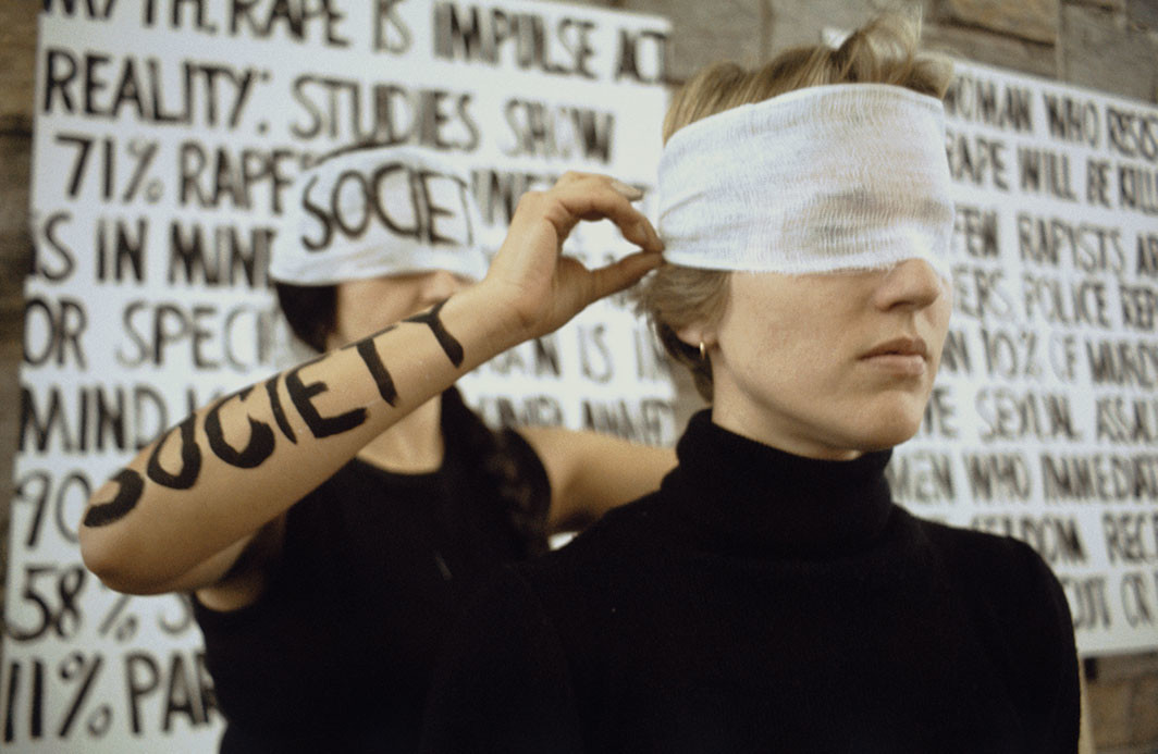 Leslie Labowitz, Myths of Rape, 1977. Performance view, Los Angeles City Mall, Los Angeles, May 19, 1977. Leslie Labowitz and Signe Dowse. From Suzanne Lacy's Three Weeks in May, 1977. Suzanne Lacy