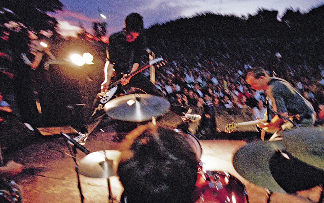 Fugazi performing at Fort Reno, Washington, DC, 1997. © Glen E. Friedman, Courtesy Akashic Books