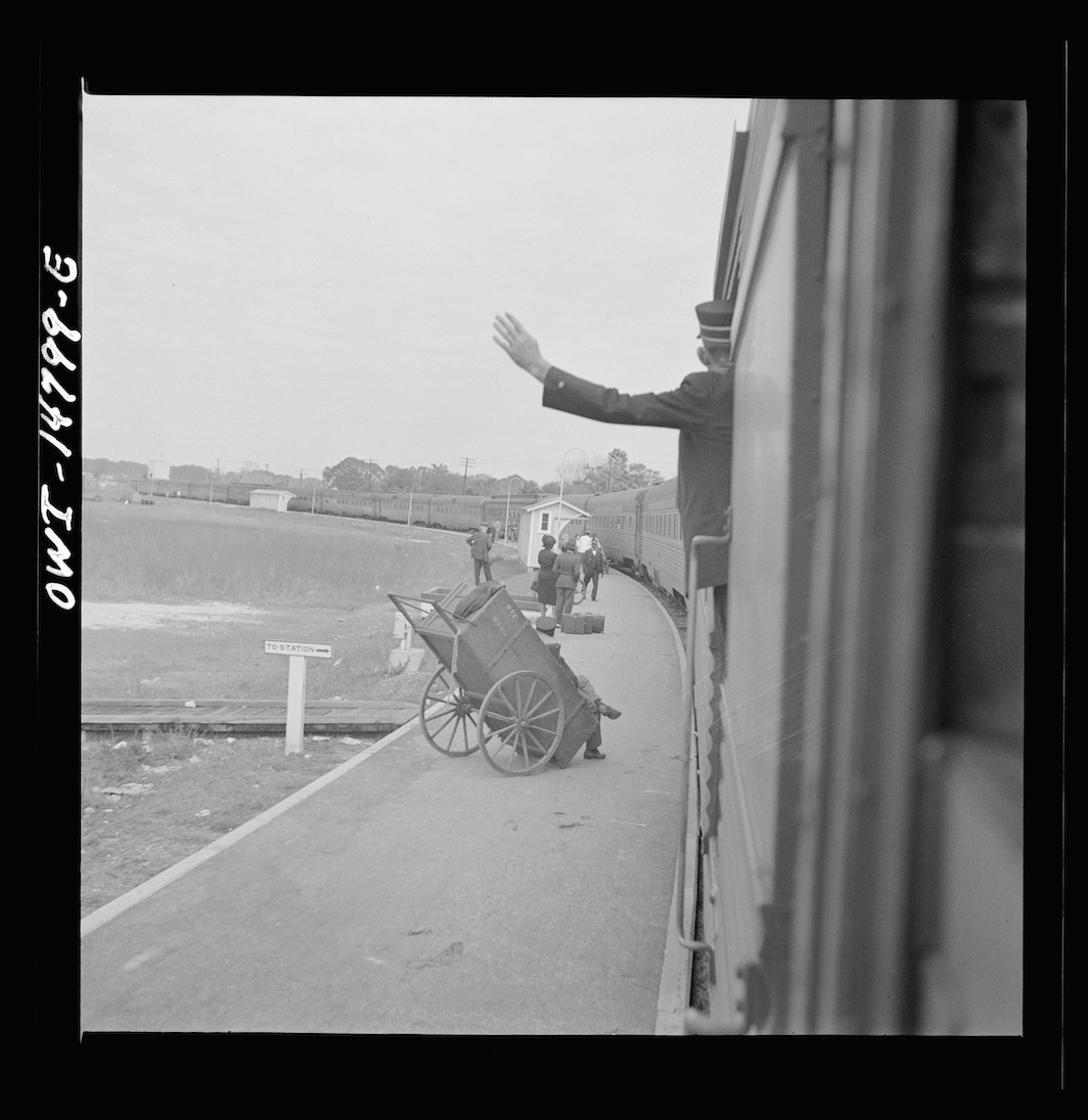 *Gordon Parks, _Trainman signaling from a "Jim Crow" coach, Saint Augustine, Florida_, 1943.* Library of Congress