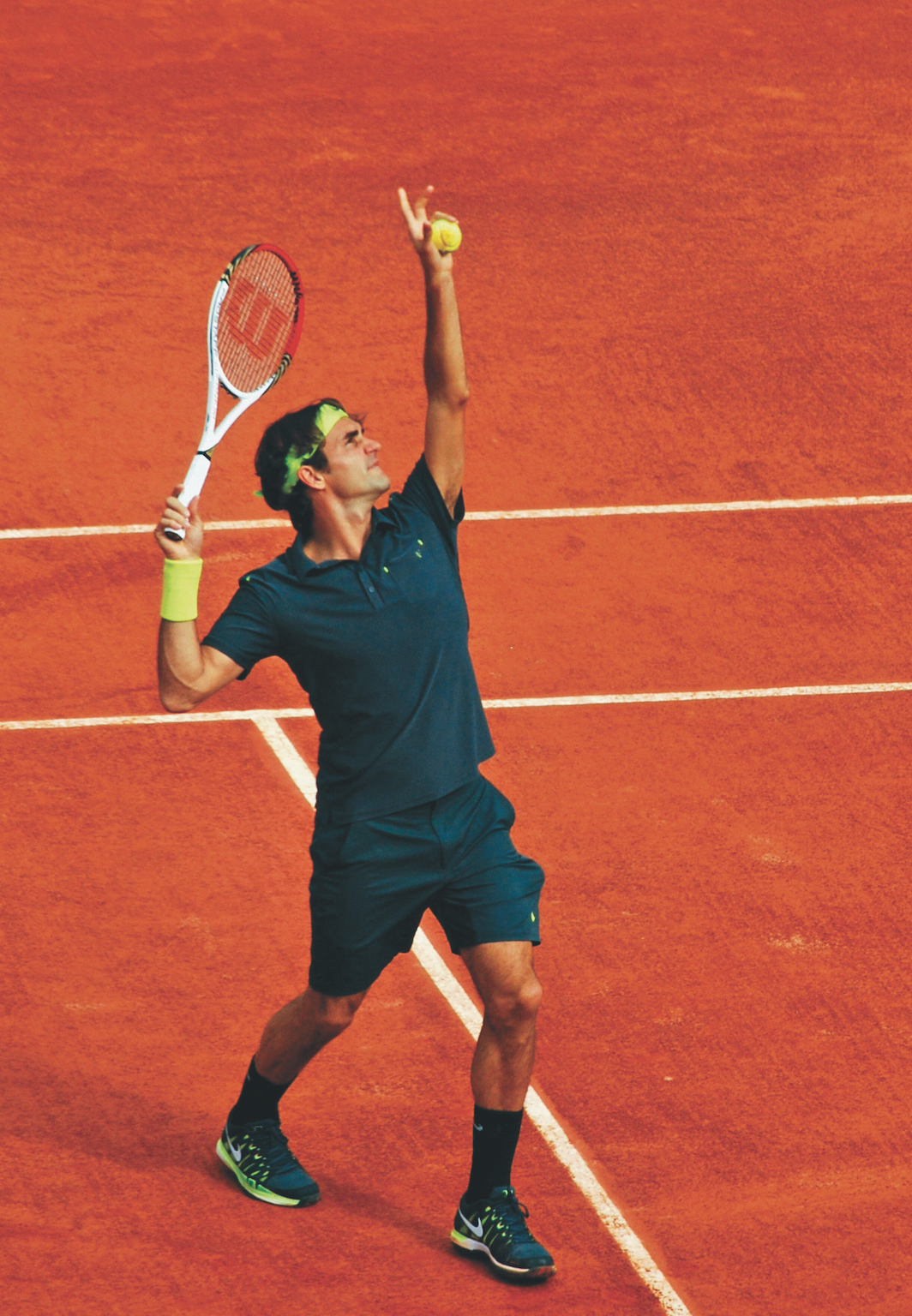 *Roger Federer playing at the 116th French Open, Stade Roland Garros, Paris, 2012.* Kate Carine/Flickr