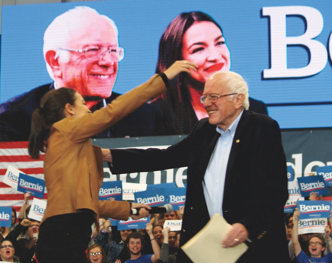 *Sen. Bernie Sanders and Rep. Alexandria Ocasio-Cortez, Council Bluffs, Iowa, November 8th, 2019.* Image: Wikicommons/Matt Johnson.